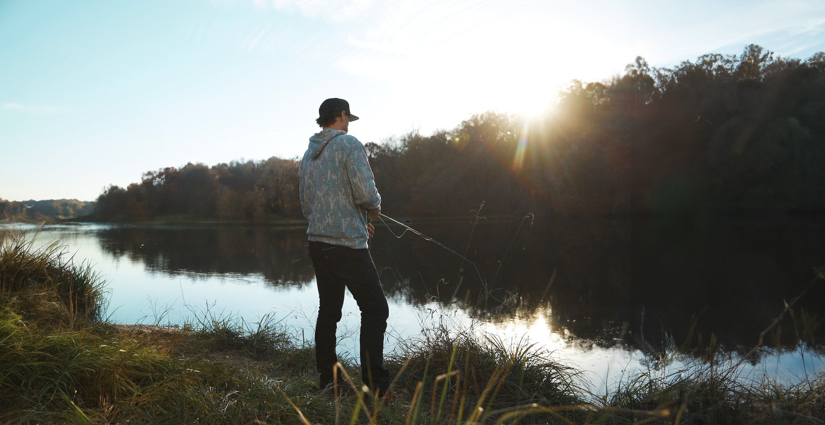 Chase Rice fishing by lake